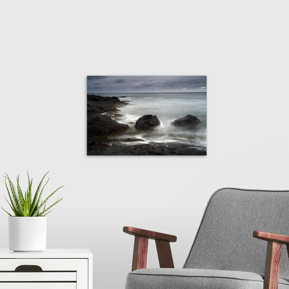 A modern room featuring Bay of Fundy Seascape at Dusk