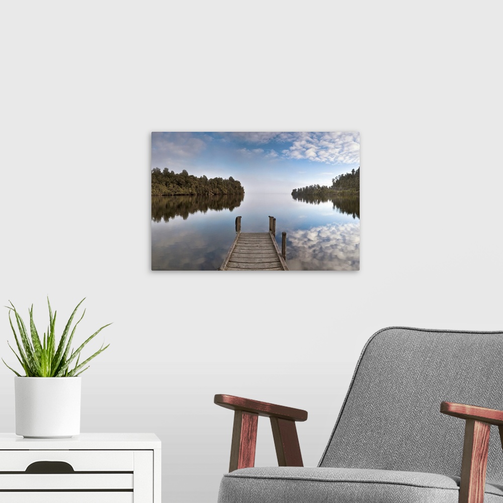 A modern room featuring Lake Mapourika, early morning panorama with mist rising off water, near Franz Josef Glacier, West...