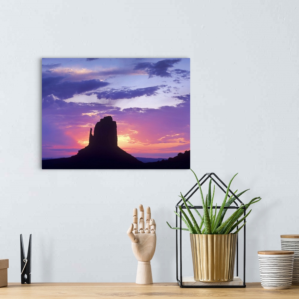 A bohemian room featuring East and West Mittens, buttes at sunrise, Monument Valley, Arizona
