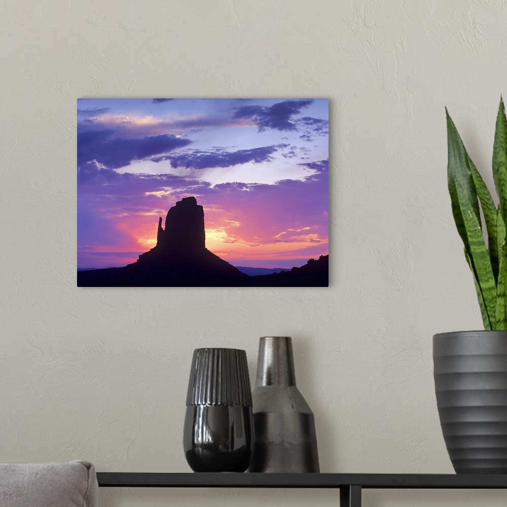 A modern room featuring East and West Mittens, buttes at sunrise, Monument Valley, Arizona