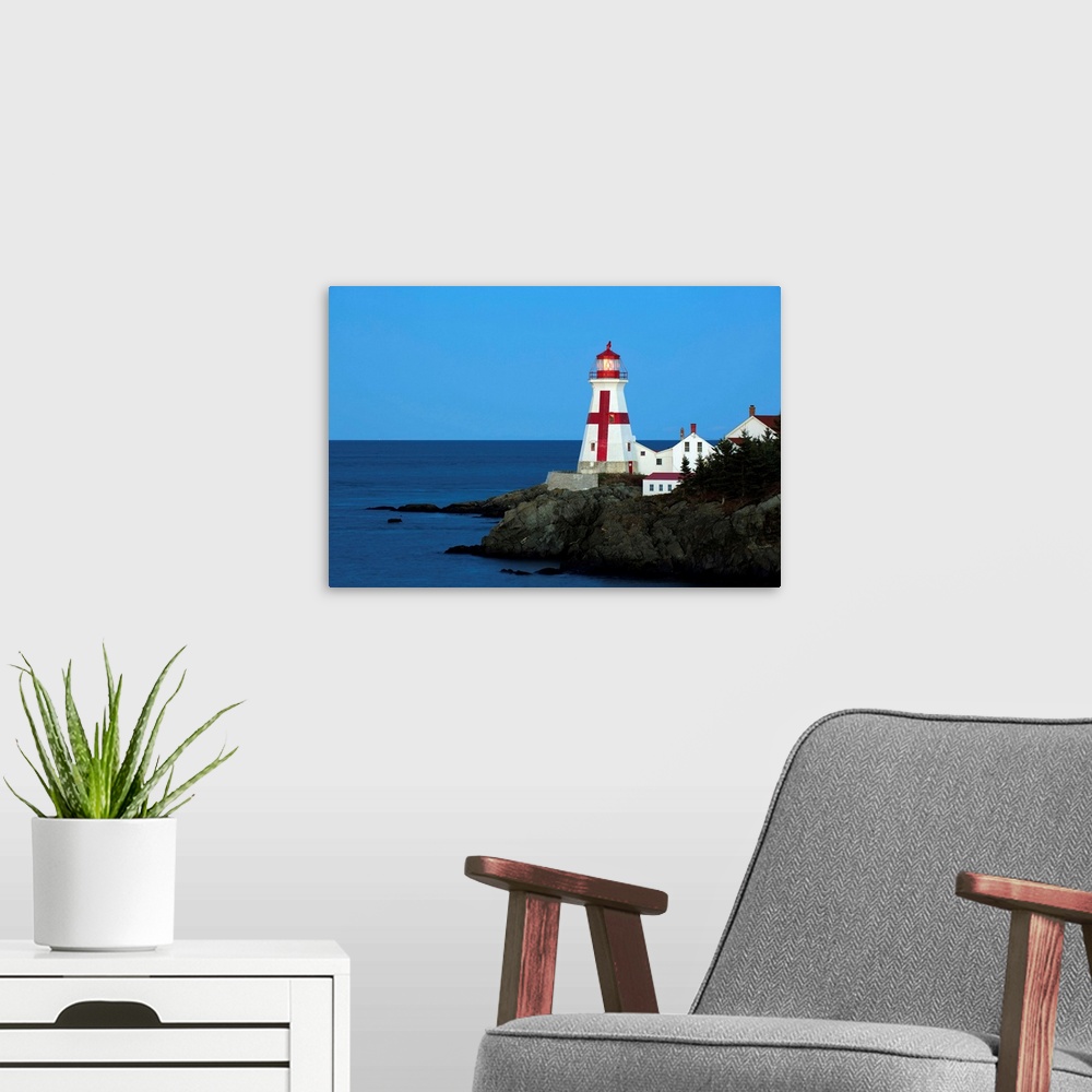 A modern room featuring Campobello Lighthouse, Gulf of Maine,dusk