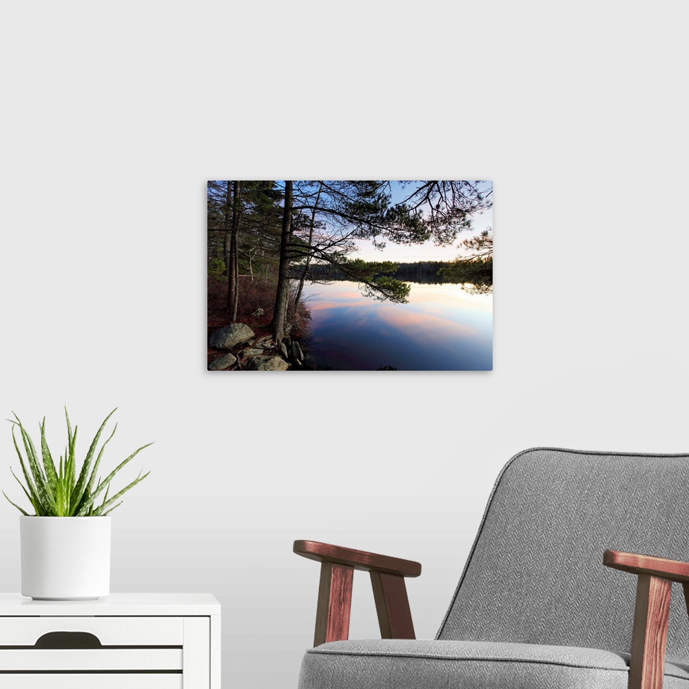 A modern room featuring sunset on kejimkujik national park lake and