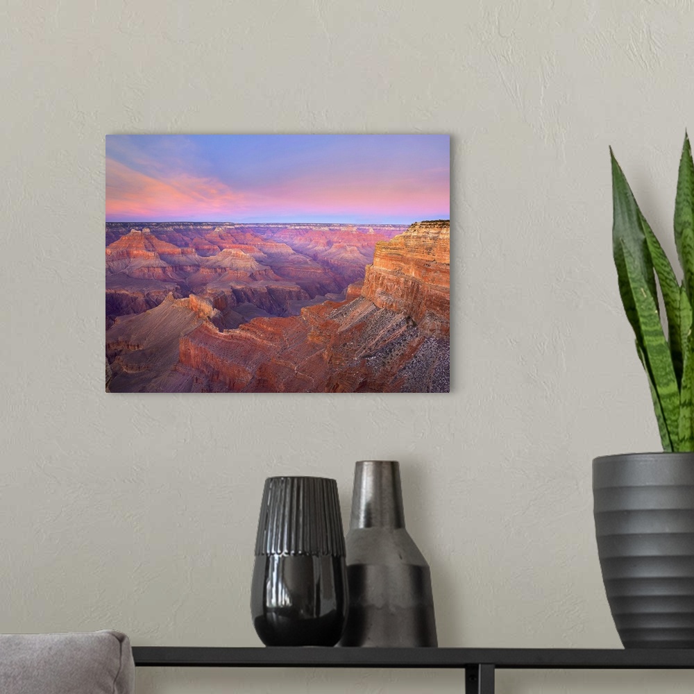 A modern room featuring Big photograph taken from Mohave Point at sunset that focuses on the great size of Grand Canyon N...