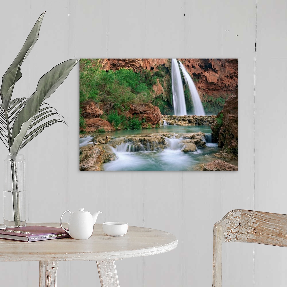 A farmhouse room featuring Time lapsed photograph of a waterfall and creek lined with cottonwood trees in a gorge carved by ...