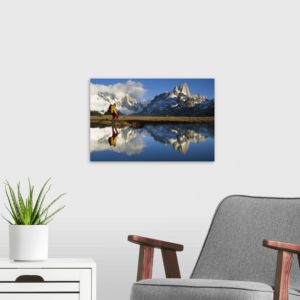 A modern room featuring Hiker, Cerro Torre and Fitzroy reflected in small pond at dawn, Loma Plieque Tumbado, Los Glaciar...