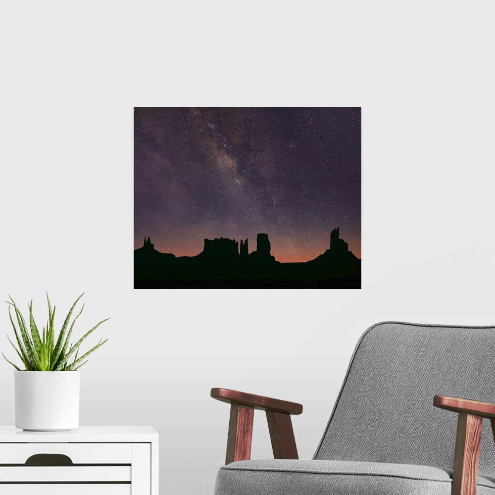 A modern room featuring Milky Way and starry sky over buttes, Monument Valley, Arizona
