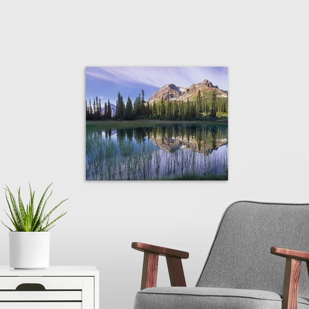 A modern room featuring Mount Jimmy Simpson reflected in pond, Banff National Park, Alberta, Canada