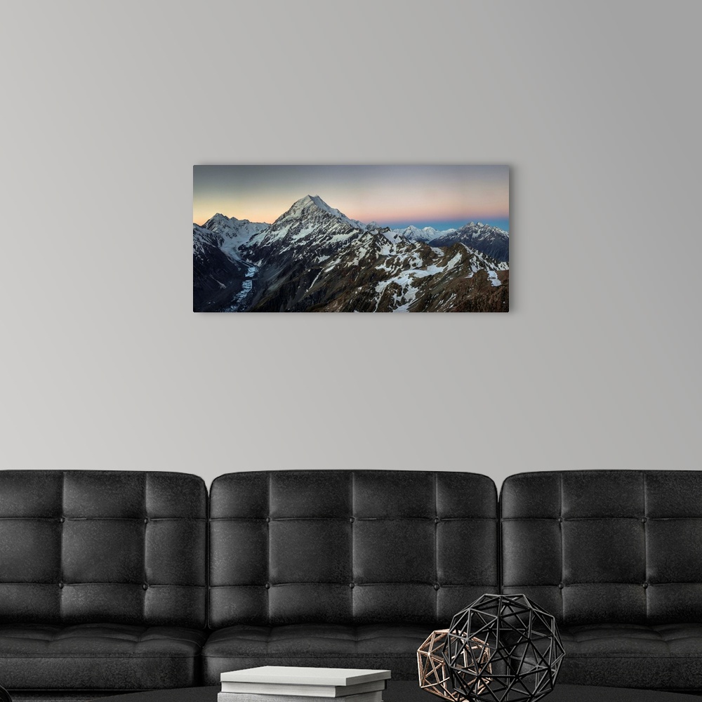 A modern room featuring Alpenglow, panorama LtoR: Mounts La Perouse, Aoraki Mount Cook, Tasman glacier, Malte Brun Range,...