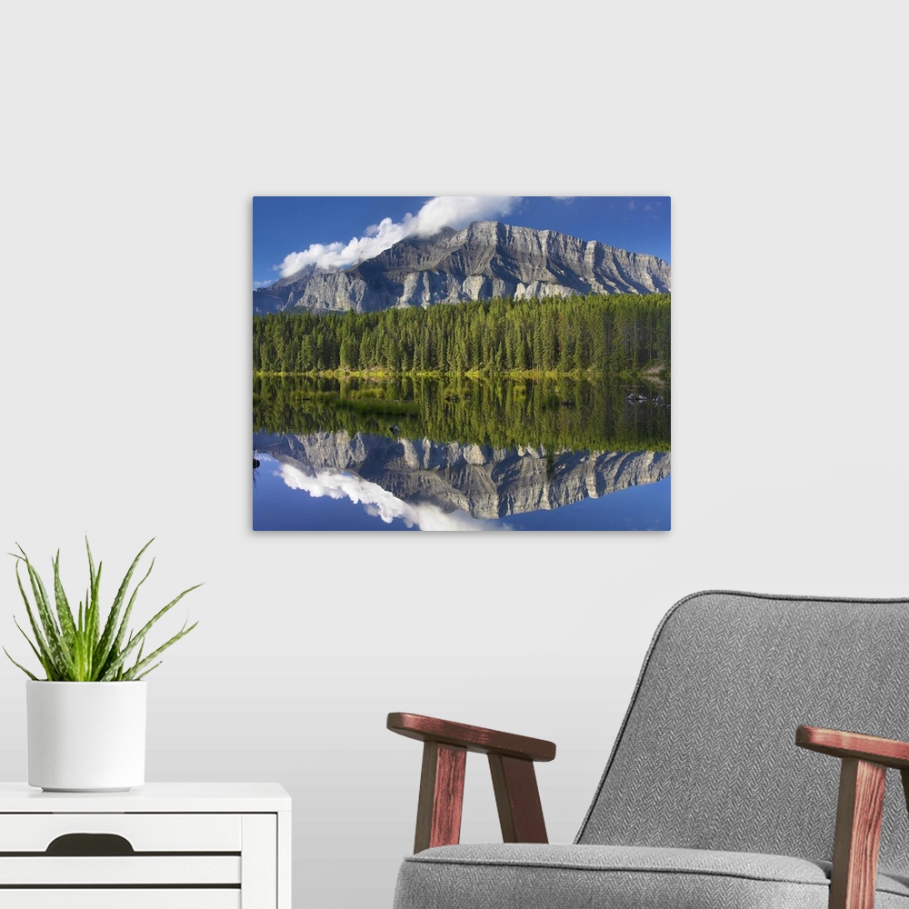 A modern room featuring Mount Rundle and boreal forest reflected in Johnson Lake, Banff National Park, Alberta, Canada