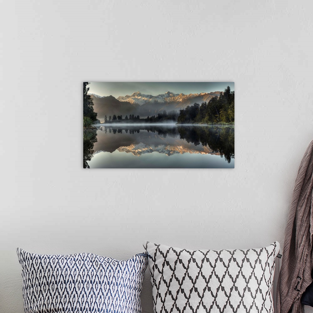 A bohemian room featuring Mount Tasman and Mount Cook reflected in Lake Matheson, South Island, New Zealand.
