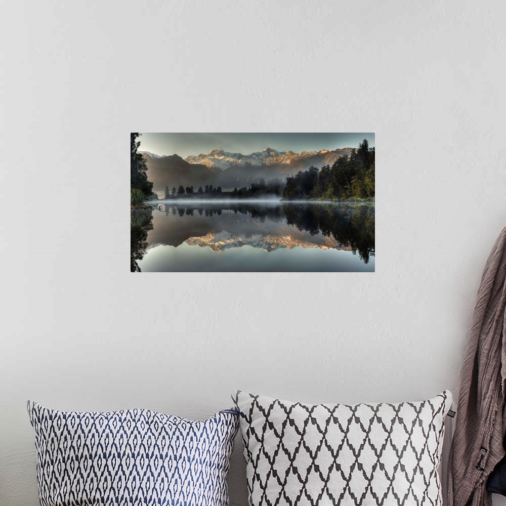 A bohemian room featuring Mount Tasman and Mount Cook reflected in Lake Matheson, South Island, New Zealand.