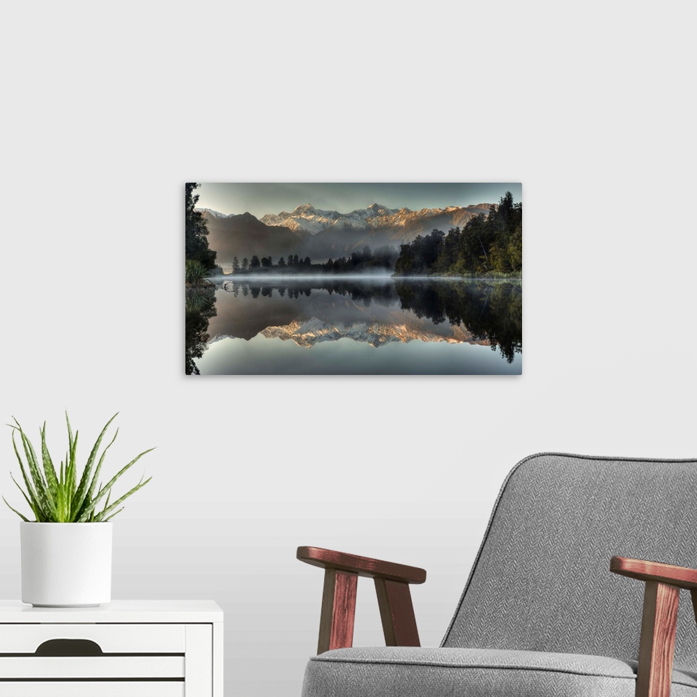A modern room featuring Mount Tasman and Mount Cook reflected in Lake Matheson, South Island, New Zealand.