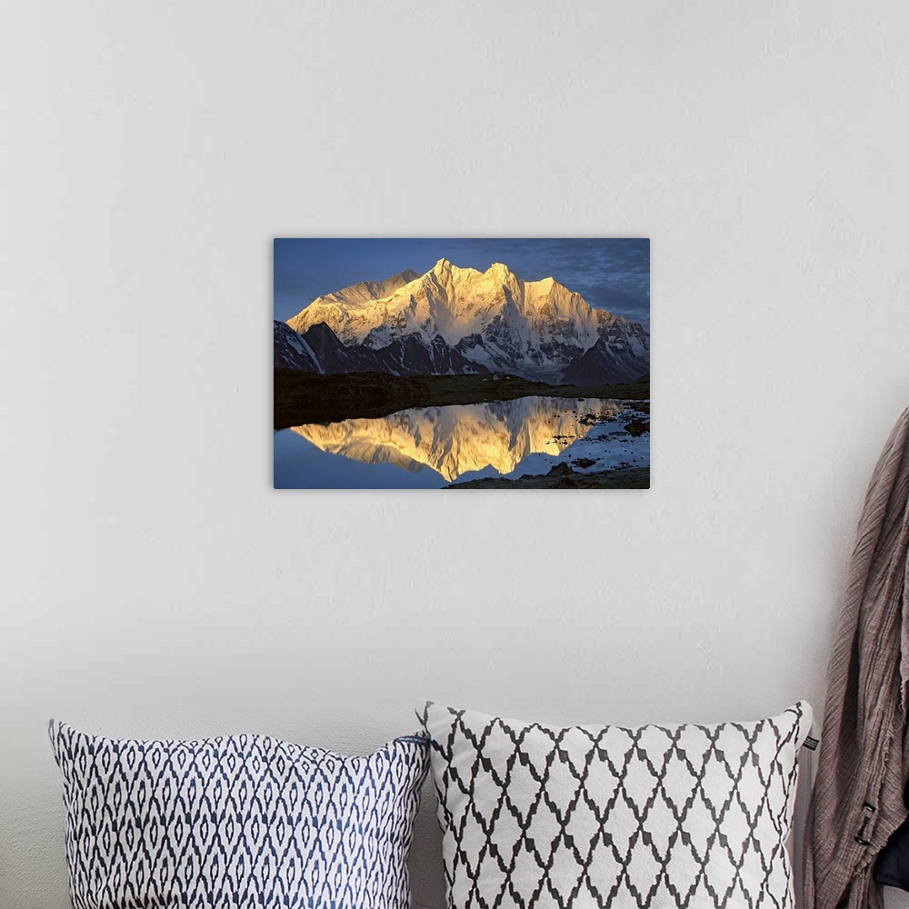 A bohemian room featuring Mt Makalu (8,462 meters) and Mt Chomolonzo (7,540 meters) bathed in dawn light, reflected in smal...