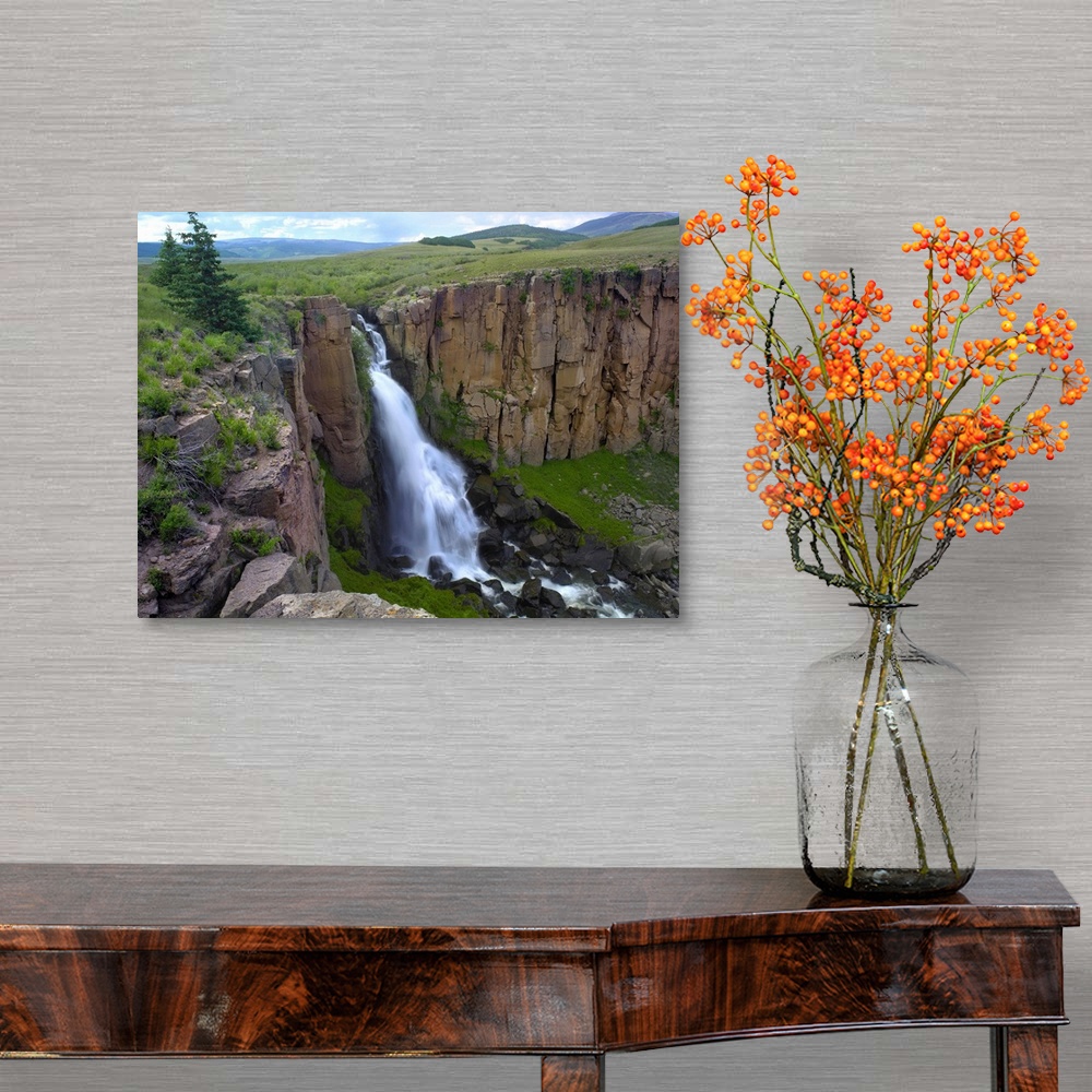 A traditional room featuring North Clear Creek Waterfall cascading down cliff, Colorado