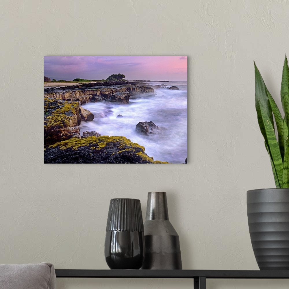 A modern room featuring Photograph of rocky cliff line that drops into the ocean under a cloudy sky.