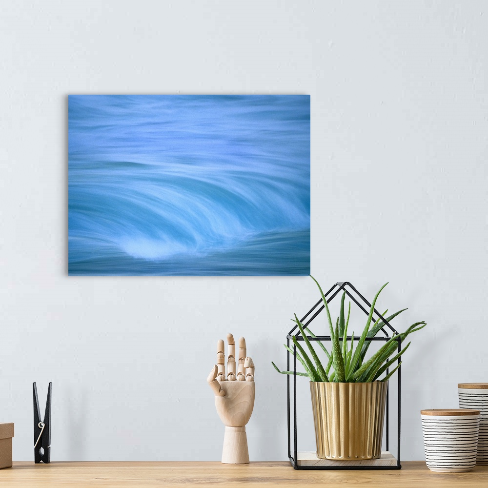 A bohemian room featuring Up-close image of water crashing down into ocean.