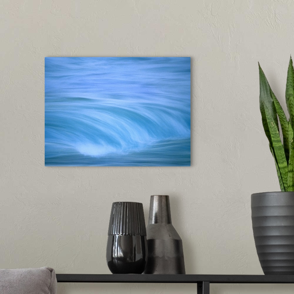 A modern room featuring Up-close image of water crashing down into ocean.