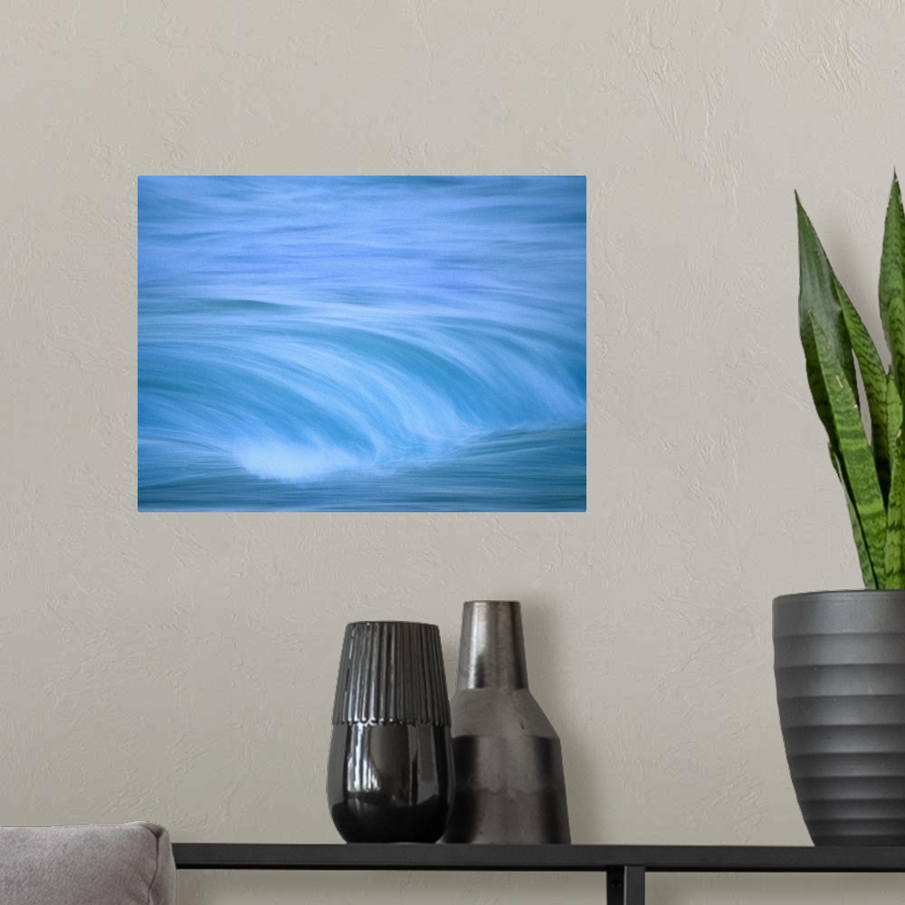 A modern room featuring Up-close image of water crashing down into ocean.