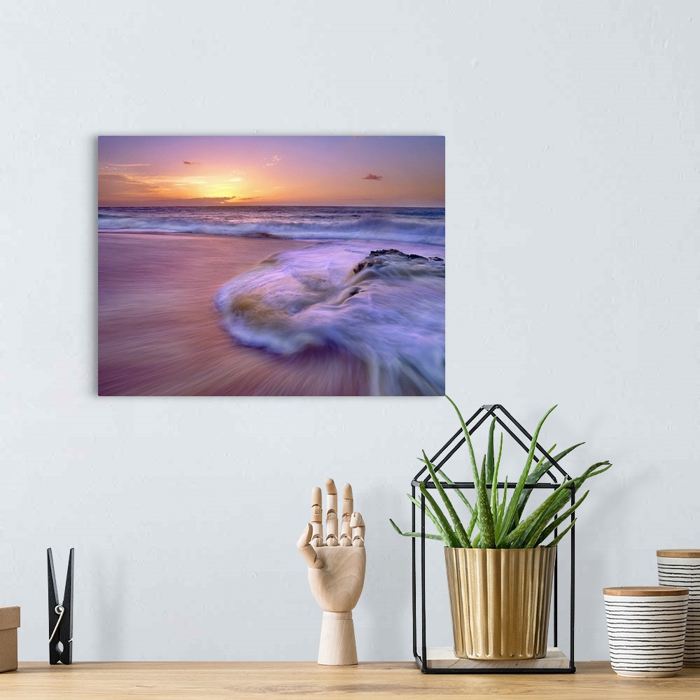 A bohemian room featuring Wall docor of waves rushing ashore on a beach with an Hawaiian sunset in the distance.