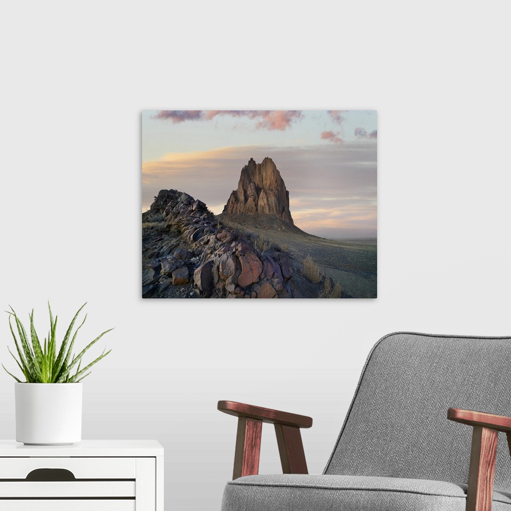 A modern room featuring Ship Rock at sunset, remnant basalt core of extinct volcano, New Mexico