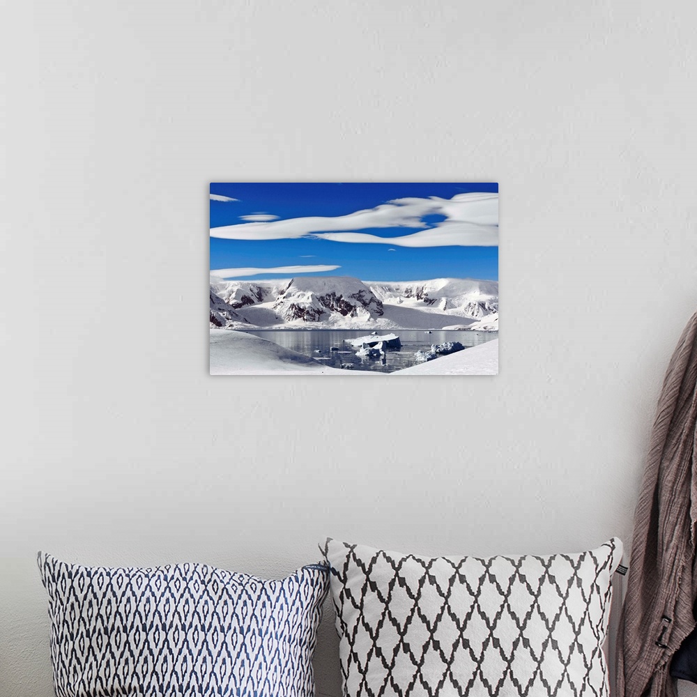 A bohemian room featuring Snow-covered mountains along coast, Antarctica.