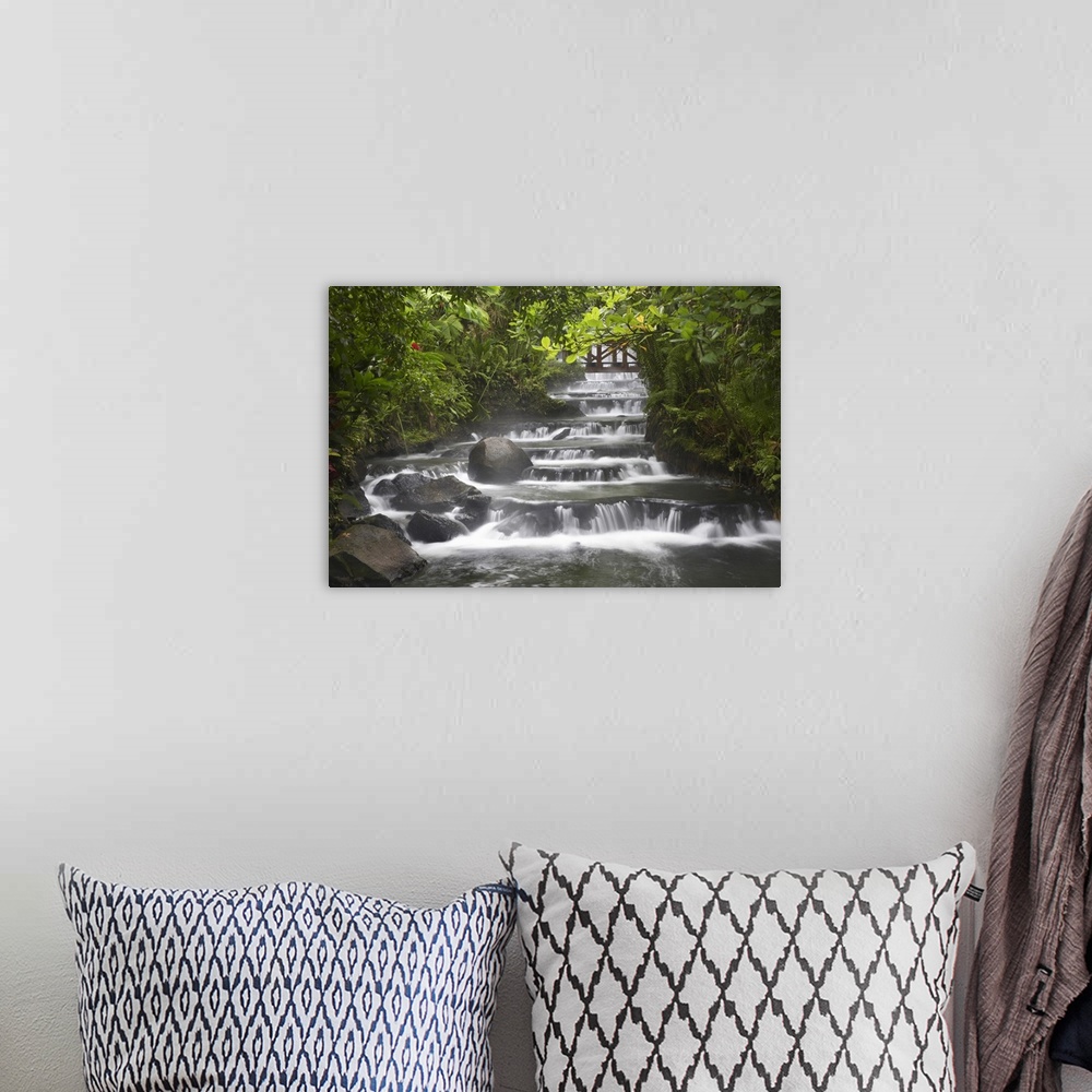 A bohemian room featuring Wall art for the home or office this landscape photograph shows a steam flowing through a forest.