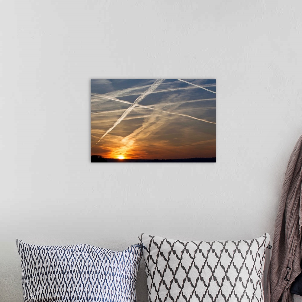 A bohemian room featuring Vapour Trails at sunset, from airliners, Germany