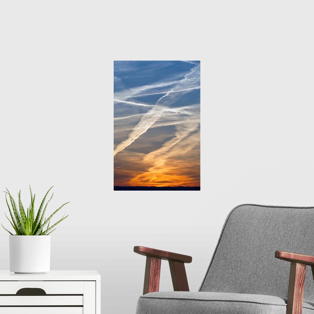 A modern room featuring Vapour Trails at sunset, from airliners, Germany