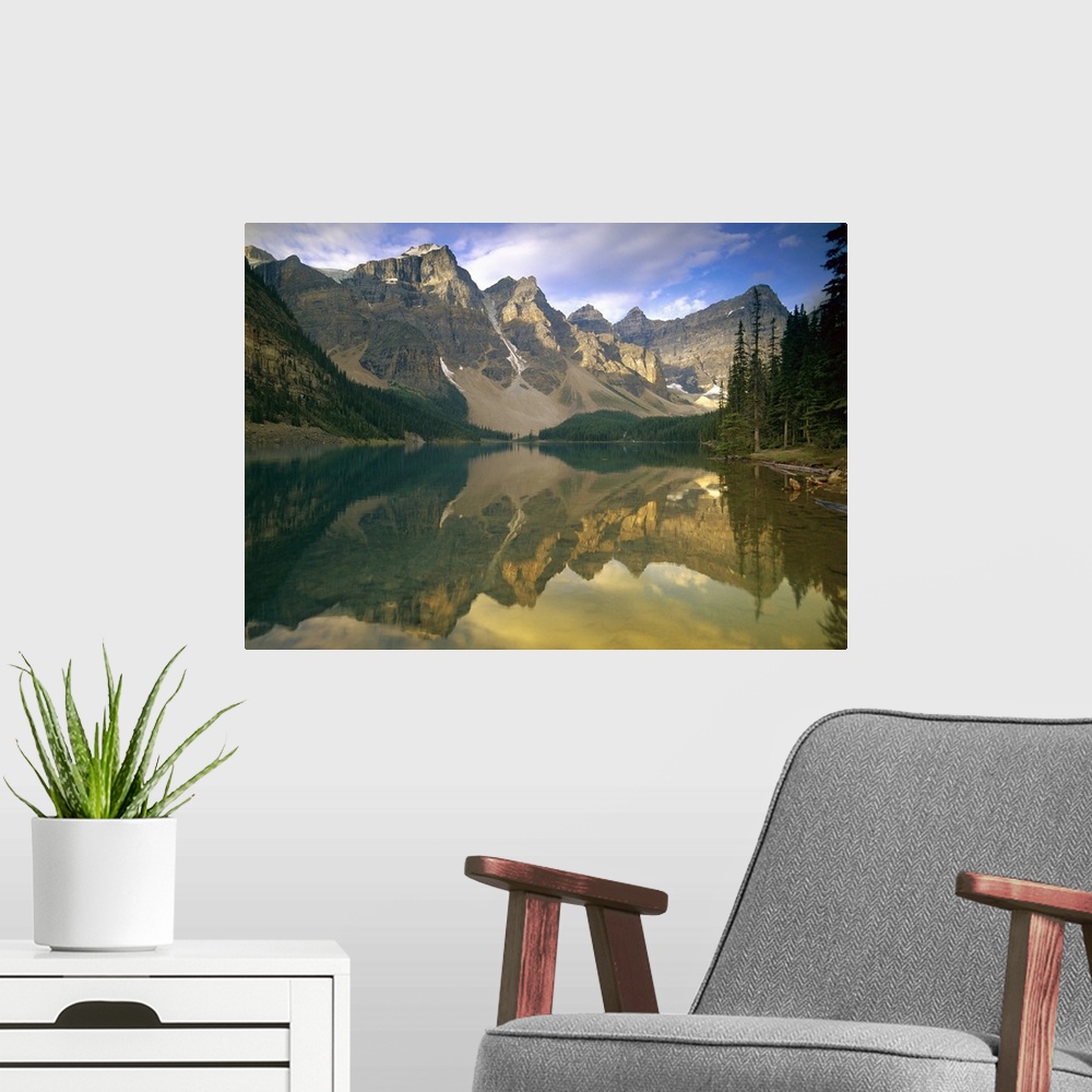 A modern room featuring The towering mountains perfectly mirrored in a still glacial lake in the Canadian Rockies, creati...