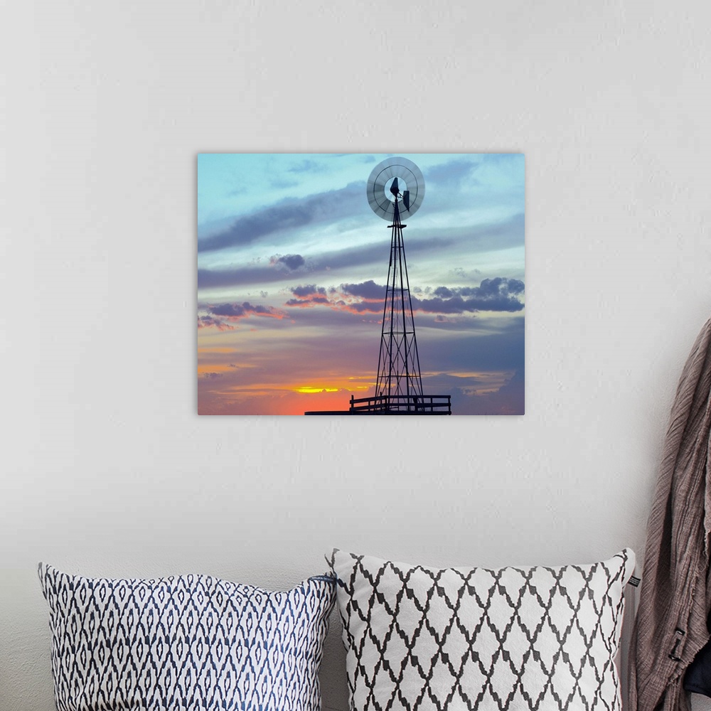 A bohemian room featuring Windmill producing electricity at sunset example of renewable energy, North America