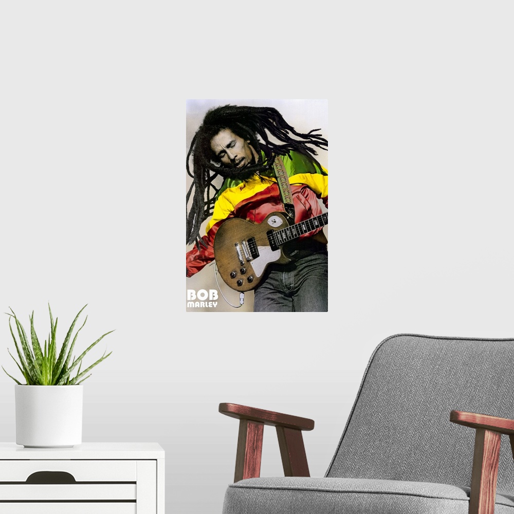 A modern room featuring Large, portrait photograph of Bob Marley playing guitar, his name in the bottom left corner.