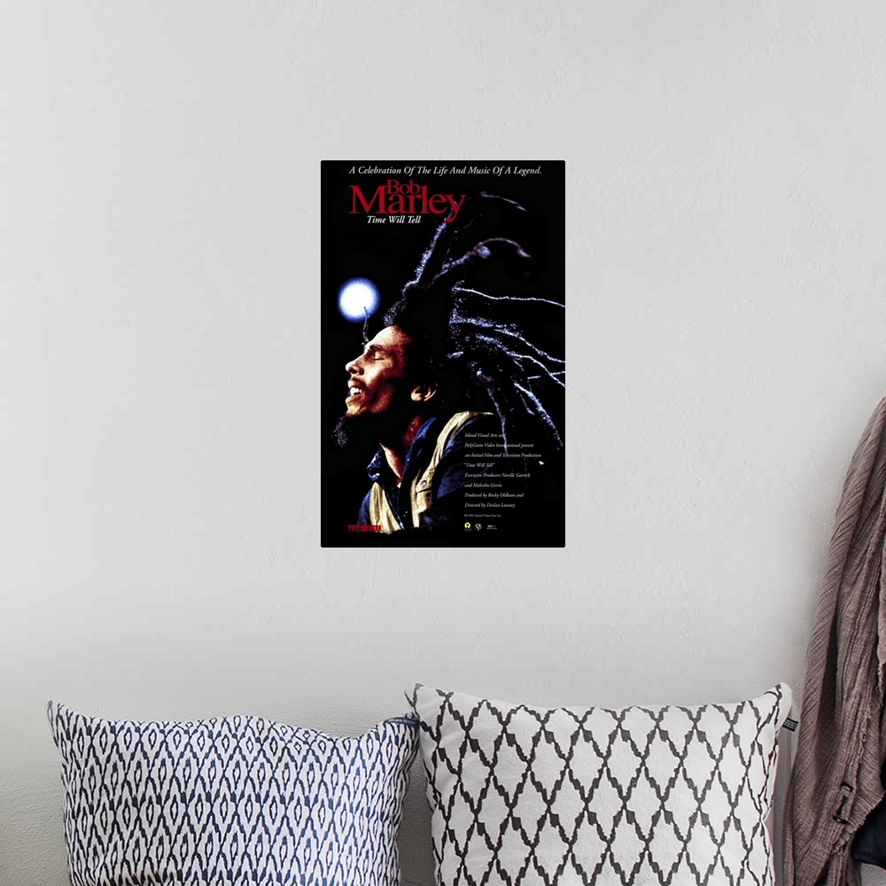 A bohemian room featuring Poster promoting Bob Marley's 1992 album Time Will Tell with a photo of Bob Marley and his long d...
