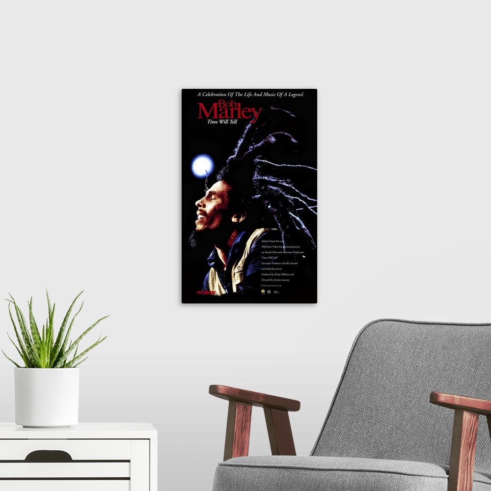 A modern room featuring Poster promoting Bob Marley's 1992 album Time Will Tell with a photo of Bob Marley and his long d...