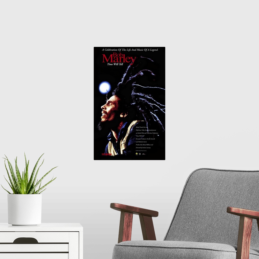 A modern room featuring Poster promoting Bob Marley's 1992 album Time Will Tell with a photo of Bob Marley and his long d...