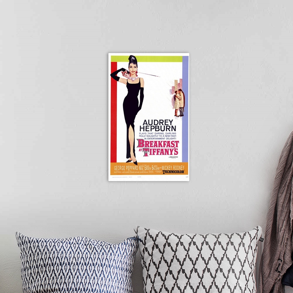 A bohemian room featuring Movie poster for "Breakfast at Tiffany's". It shows Audrey Hepburn standing in a black gown with ...