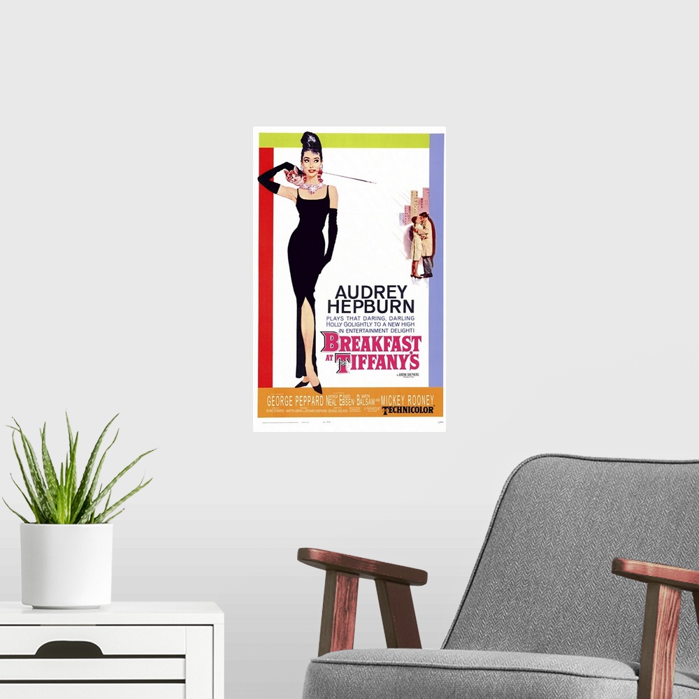 A modern room featuring Movie poster for "Breakfast at Tiffany's". It shows Audrey Hepburn standing in a black gown with ...