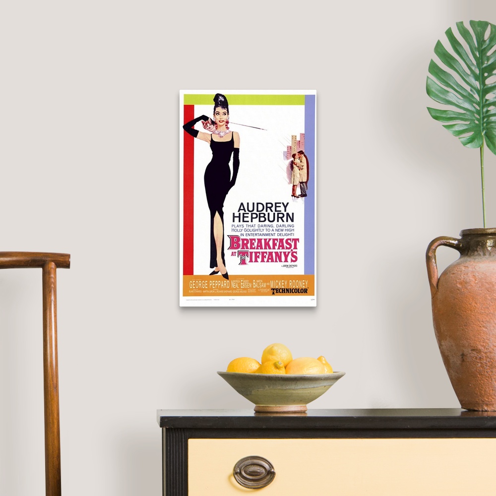 A traditional room featuring Movie poster for "Breakfast at Tiffany's". It shows Audrey Hepburn standing in a black gown with ...