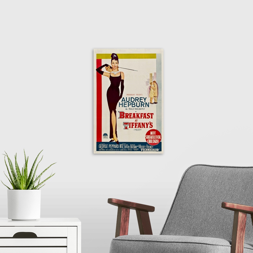 A modern room featuring Vertical, large vintage advertisement for the movie "Breakfast At Tiffany's", with actress Audrey...