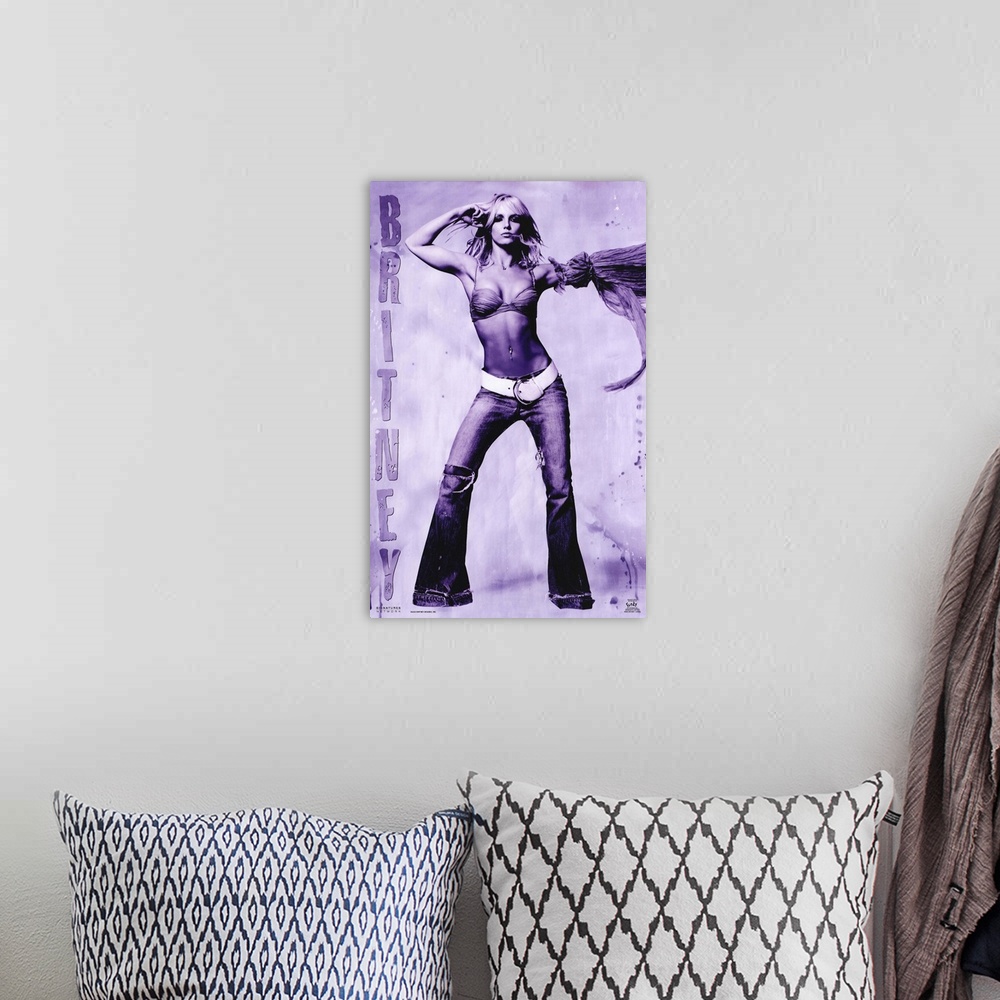 A bohemian room featuring Oversized, vertical music poster on a wall hanging of Britney Spears, standing with arms raised, ...
