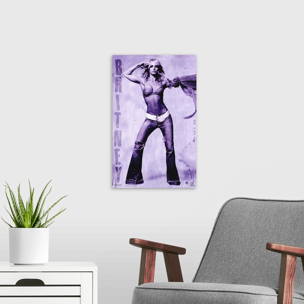 A modern room featuring Oversized, vertical music poster on a wall hanging of Britney Spears, standing with arms raised, ...