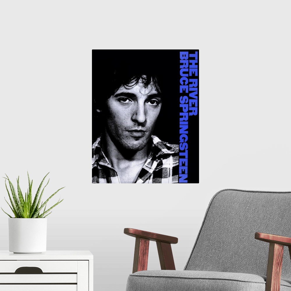 A modern room featuring Movie poster for the 2003 concert film Bruce Springsteen and the E Street Band featuring a black ...