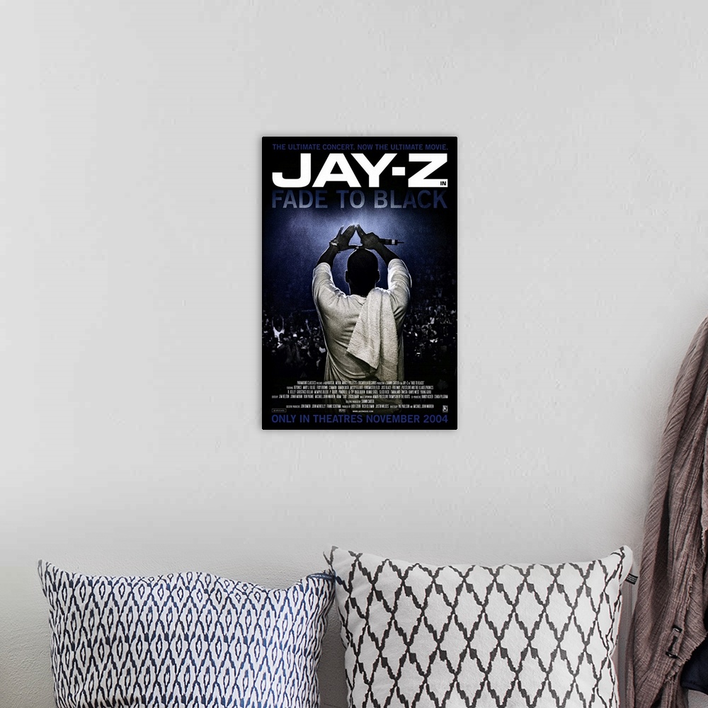 A bohemian room featuring Vertical movie advertisement for the 2004 film, Fade to Black, starring Jay-Z.  Jay-Z stands faci...
