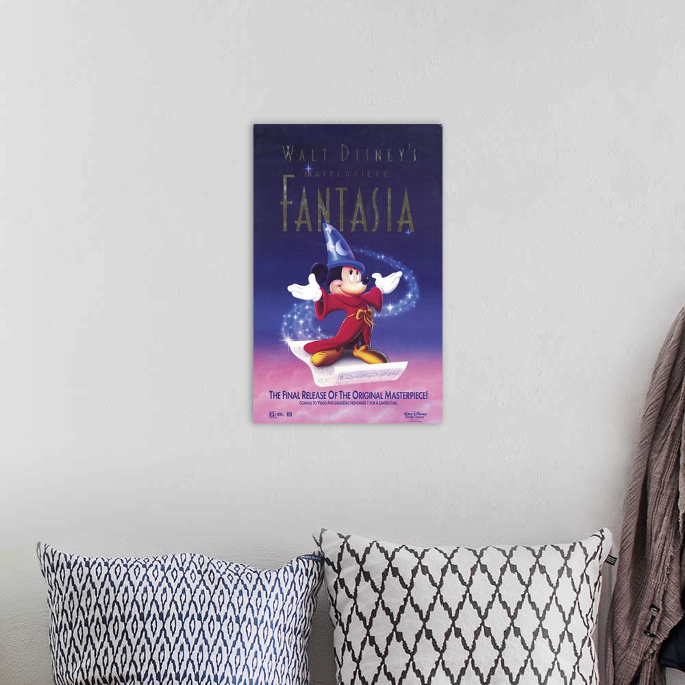 A bohemian room featuring Movie poster for Disney's 1940 film Fantasia. Mickey wears a red robe and blue pointy hat as he s...