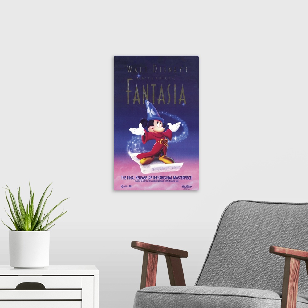 A modern room featuring Movie poster for Disney's 1940 film Fantasia. Mickey wears a red robe and blue pointy hat as he s...