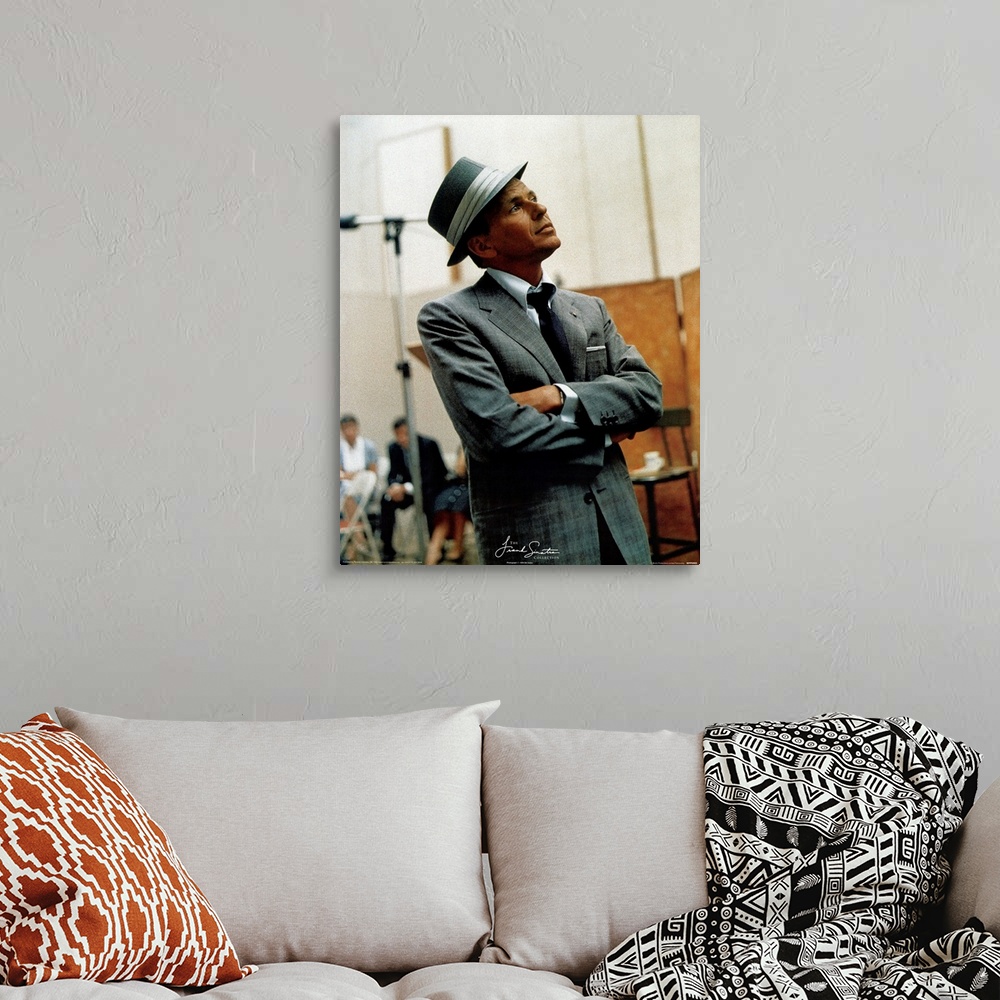 A bohemian room featuring Photograph of Frank Sinatra looking off into the distance with blurred people in the background.