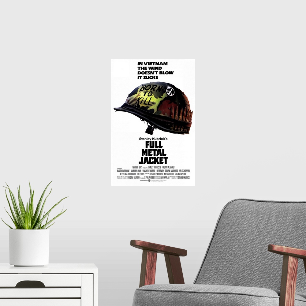 A modern room featuring Poster for the hit movie "Full Metal Jacket". A military helmet is pictured with a peace sign on ...