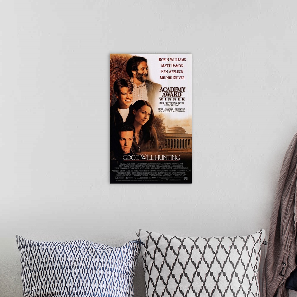 A bohemian room featuring The movie poster for Good Will Hunting showing all of the main characters on the left side with a...