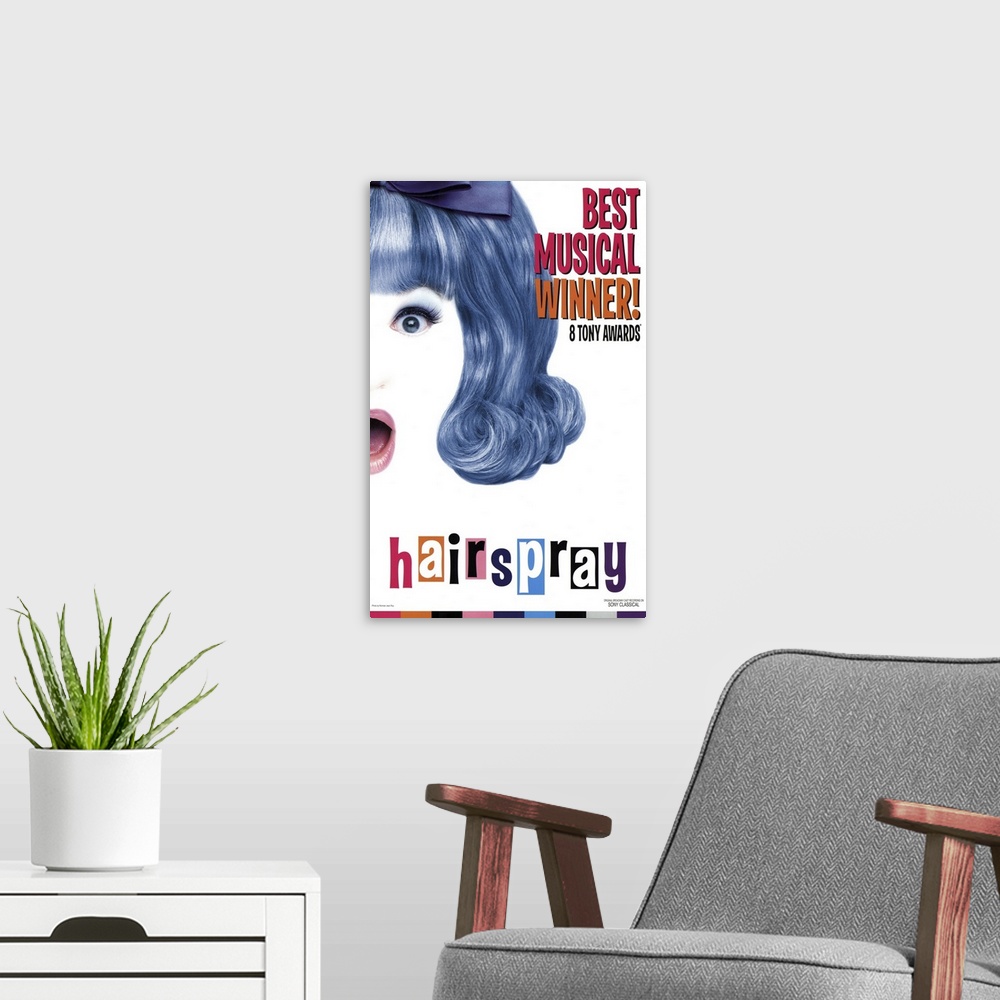 A modern room featuring Poster for the Broadway rendition of Hairspray. It shows half the face and hair of one of the mai...