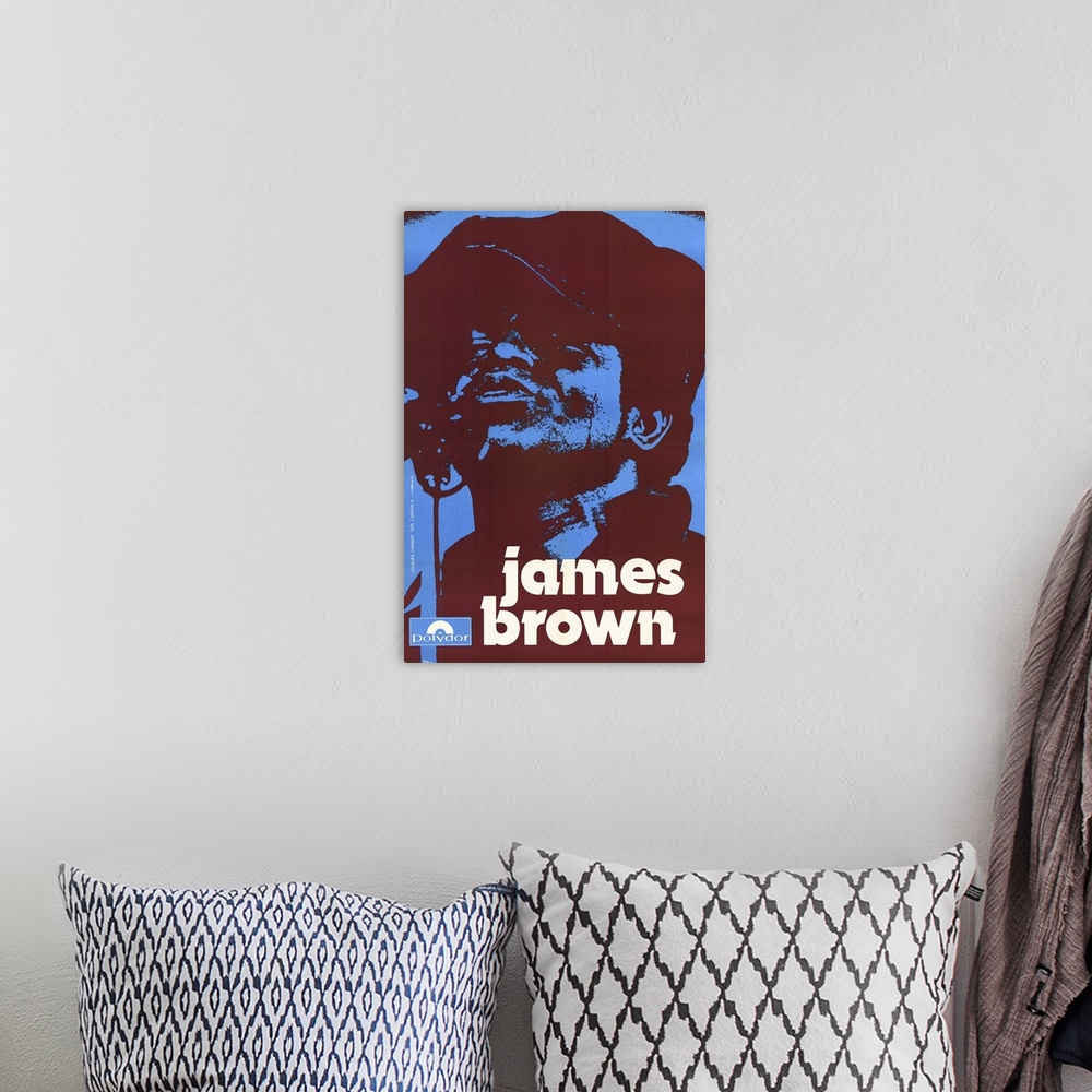 A bohemian room featuring A vintage poster of James Brown that uses only blue and a deep red color to silhouette his portrait.
