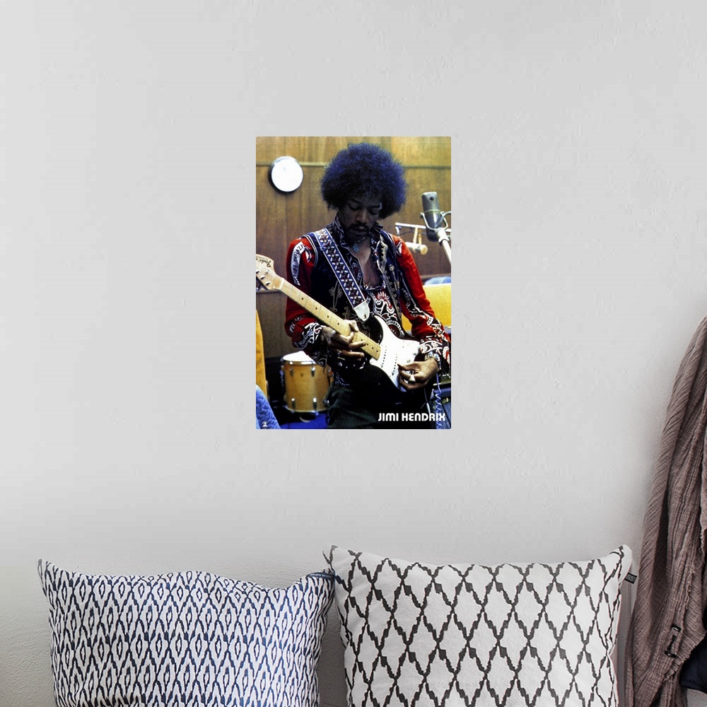 A bohemian room featuring Vintage color photograph of the musician Jimi Hendrix strumming an electric guitar and wearing a ...